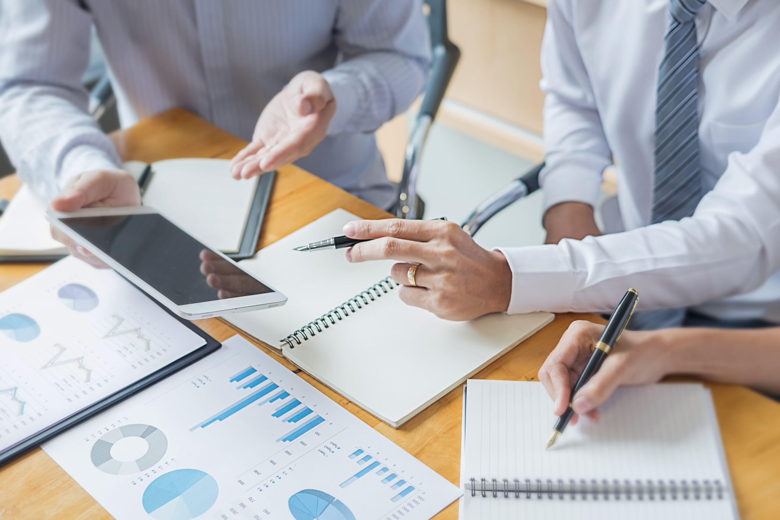 Business adviser analyzing financial figures denoting the progress Internal Revenue Service checking document. Audit concept
